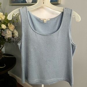 St.john small light shiny blue top , in perfect condition.